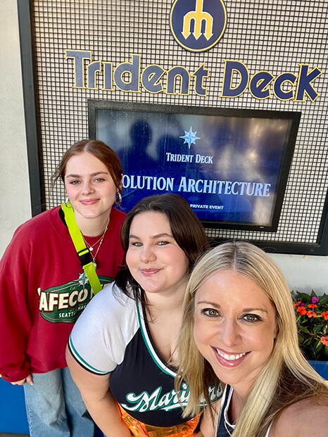 Three in Front of Trident Deck Sign