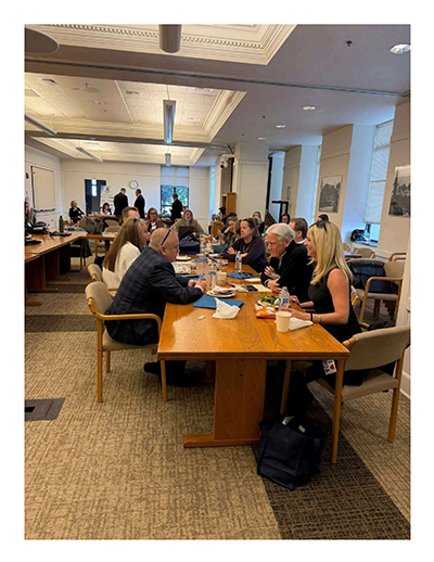 WSCAI Olympia Day participants seated around a long table during a legislative roundtable discussion inside the Washington State Capitol